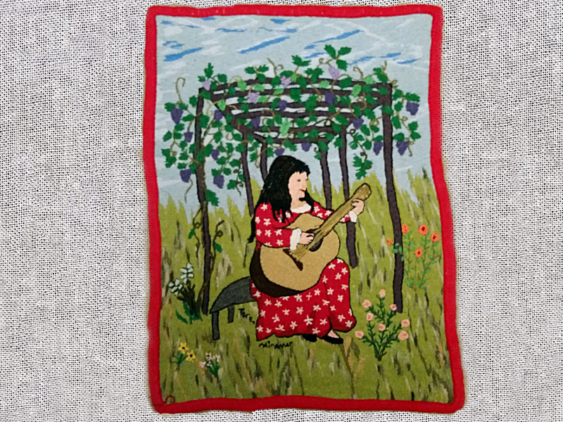 Obra textil de paisaje patrimonial bordado en lana de colores