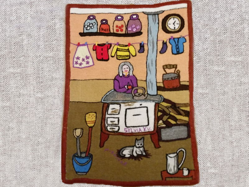 Obra textil de paisaje patrimonial bordado en lana de colores