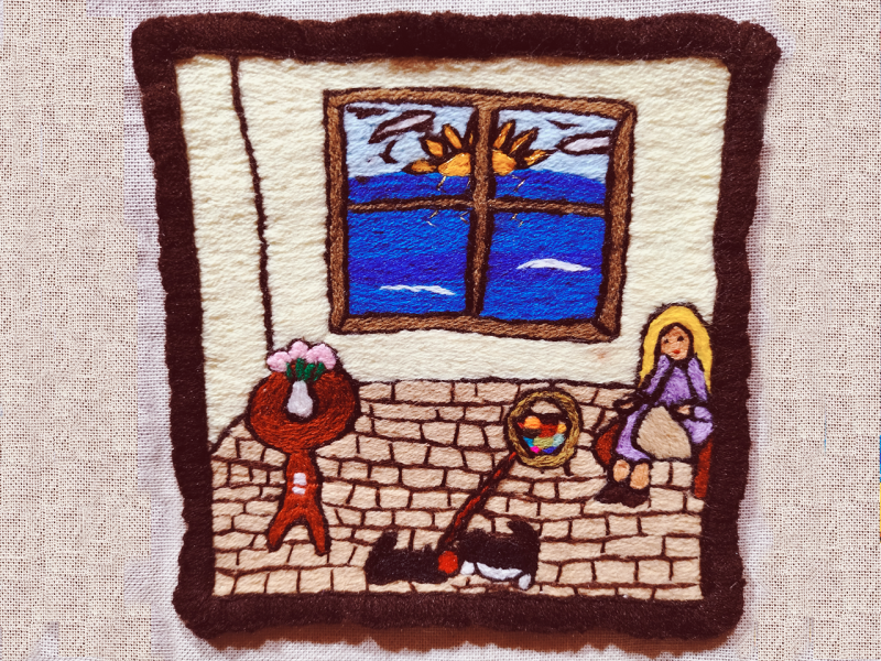 Obra textil de paisaje patrimonial bordado en lana de colores