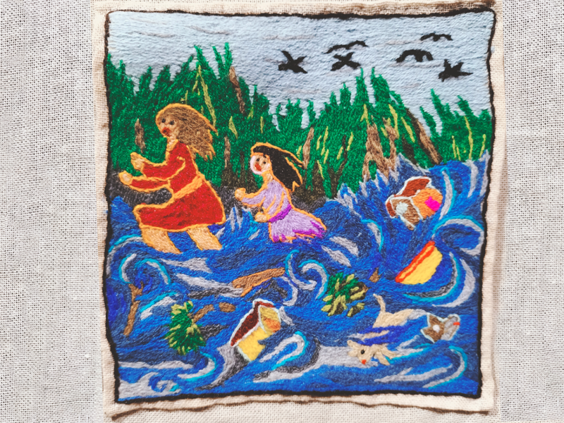 Obra textil de paisaje patrimonial bordado en lana de colores